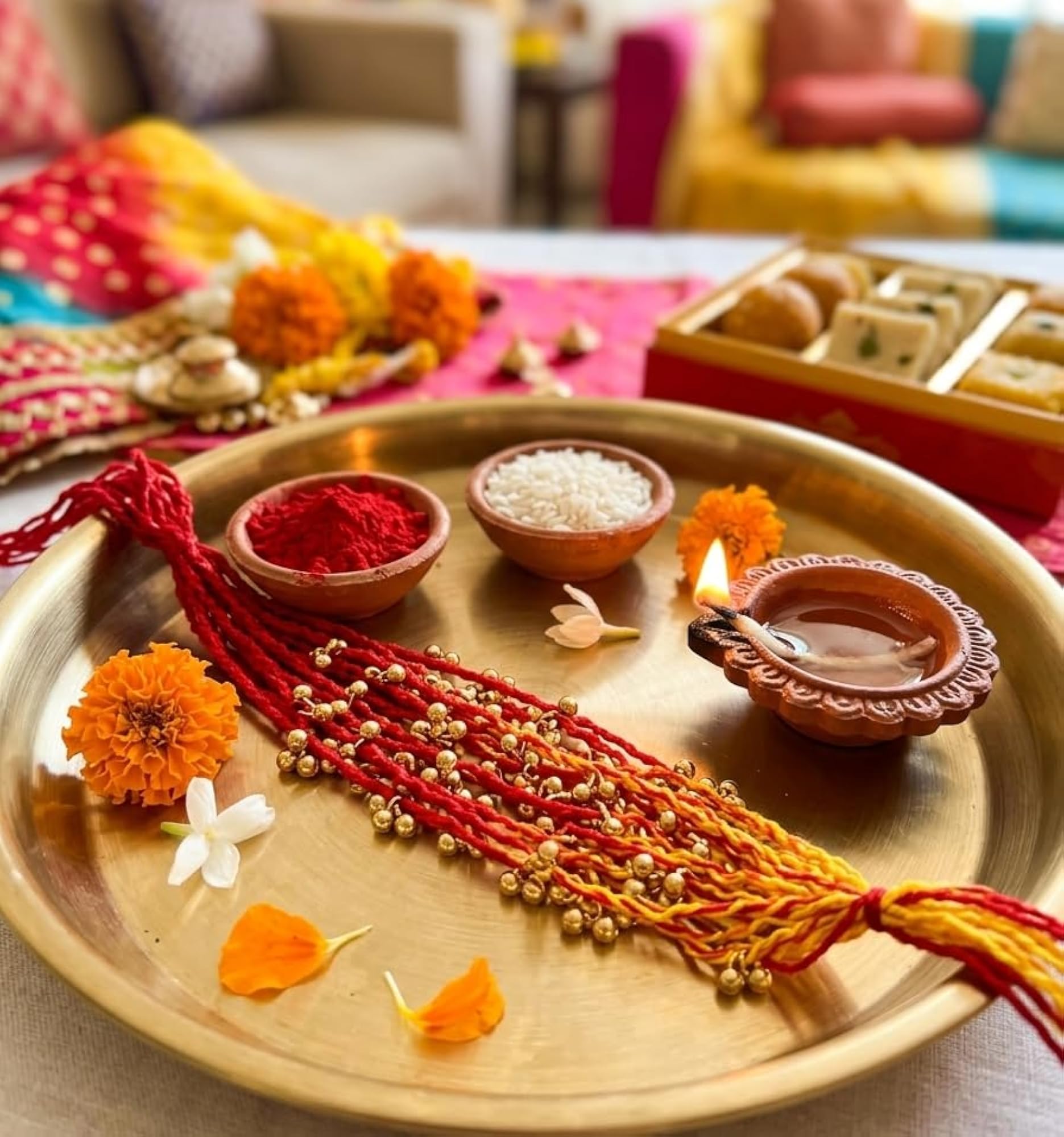 Set of 12 Moli Thread Rakhis with Golden Ghungroo
